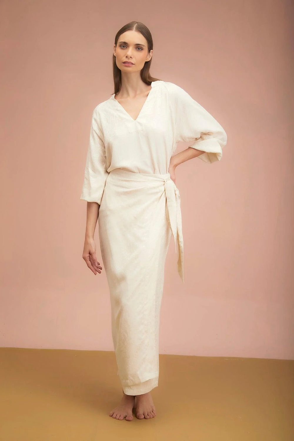Falda Radiante ANARIAS Atelier — detalle de cintura con resorte trasero y botones internos